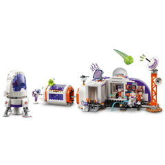 LEGO Friends Mars Space Base set featuring a white and purple rocket, an exploration rover, and three mini-dolls in astronaut attire.