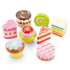 New Classic Toys cake stand set features six vibrant plastic items in pink, yellow, and green, arranged playfully.