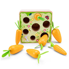 Carrot Picking Game features a wooden surface with a green and yellow design and multiple orange carrots with green stems.