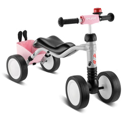 Puky Wutsch Bundle quadricycle in pink and gray, featuring a black seat, silver frame, and black wheels with white centers.