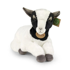 Plush goat stuffed animal in black and white with a collar and bell, featuring tags on its ear and collar.