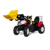 Rollyfarmtrac Premium II Steyr 6300 Terrus CVT riding toy in glossy yellow, red, and white with shiny metal details and black
