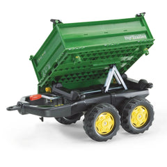 Rollymega green trailer with a flat top, black wheels and frame, featuring yellow wheel hubs, designed for riding toys.