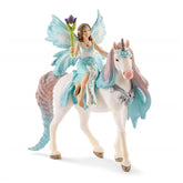 Fairy Eyela figure with translucent wings and tail, featuring a blue dress and brown mane, made of plastic-like material.