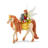 Schleich Bayala Fairy Marween with glitter unicorn features a white horse, red-haired girl in green and red, holding a blue c
