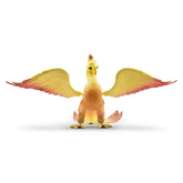 Schleich Bayala Phoenix toy figure with a yellow body, pink wing, and yellow feet, displayed from the front.
