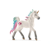 Schleich Sea Unicorn Foal figure in glossy white plastic with colorful mane and tail, featuring black eyes and brown hooves.