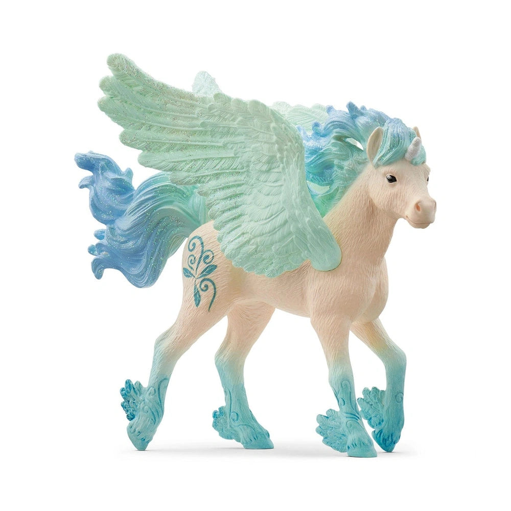 Stormy Unicorn Foal figurine with white body and blue mane, tail, hooves, and wings, showcasing a magical design.