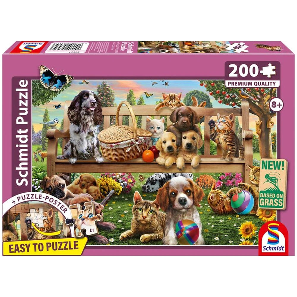 Schmidt Puzzle box showcases a colorful outdoor scene with playful dogs and cats, inviting children to enjoy a fun puzzle exp