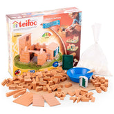 Teifoc Castle-House toy set with colorful plastic bricks, blue bowl, and green lid displayed in an open box on a light surfac