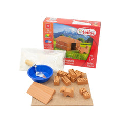 Teifoc doghouse building set with 17 pieces, featuring light brown components, a blue bowl, and a wooden base in a colorful b