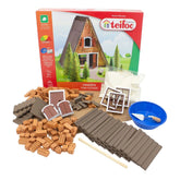 Teifoc Finnish hut construction toy set includes wooden planks, a blue hammer, and bowl, all in a white background.