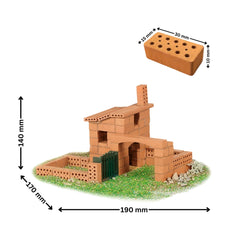 Teifoc Spanish-style house model made of brown brick-like material, surrounded by green grass and small stones.