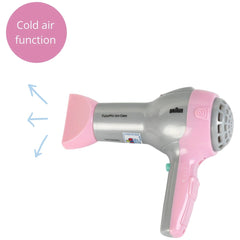 Theo Klein Braun hairdryer in pink and silver with nozzle, buttons, and "FUTURPRO ION CARE" text for pretend play.