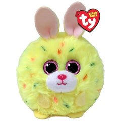 Bright yellow plush toy rabbit with a pink face, large ears, and a heart, featuring glossy eyes and colorful patterns.