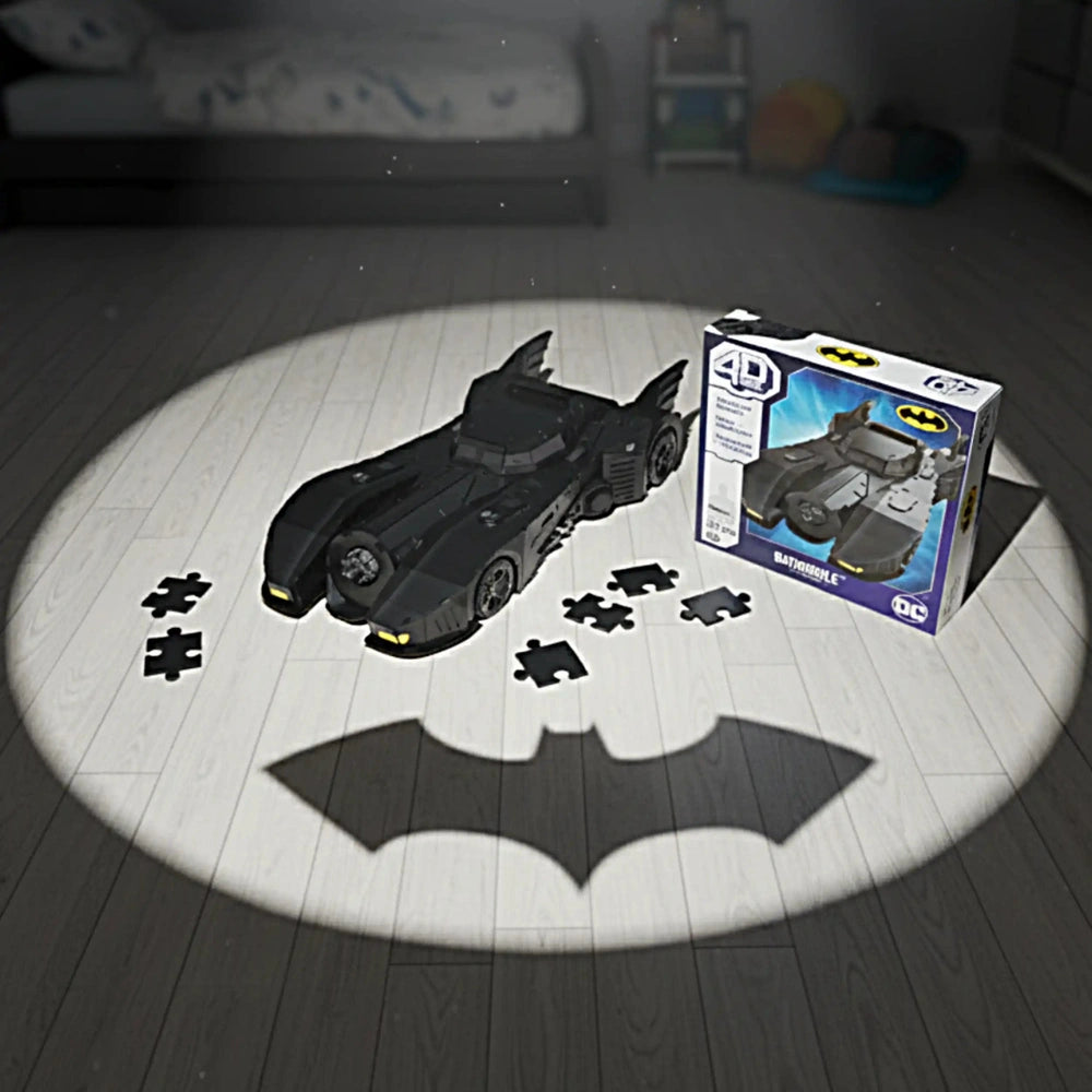 4D Build DC Batman Retro Batmobile 3D puzzle model kit displayed on a wooden floor beside its branded box.