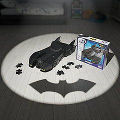 4D Build DC Batman Retro Batmobile 3D puzzle model kit displayed on a wooden floor beside its branded box.