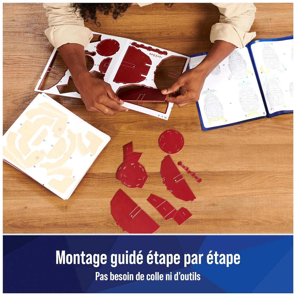 4D Build Marvel Iron Man 3D puzzle model kit being assembled with red plastic pieces on a wooden table.