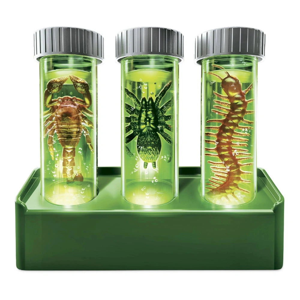KidzLabs Glow Critter Lab toy playset features three green transparent containers with gray lids, showcasing yellow and brown