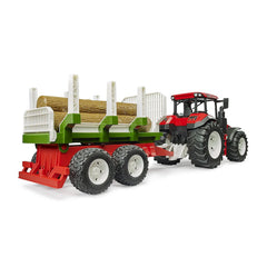 Red Bruder tractor with a forwarding trailer carrying three tree trunks, featuring large tread tires for realistic play.