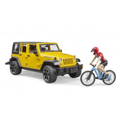 Yellow Jeep Wrangler Rubicon toy with cyclist on a blue mountain bike, highlighting adventure playset.