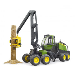 Bruder John Deere 1270G Harvester toy with rotating cabin and articulated arm gripping a tree trunk.