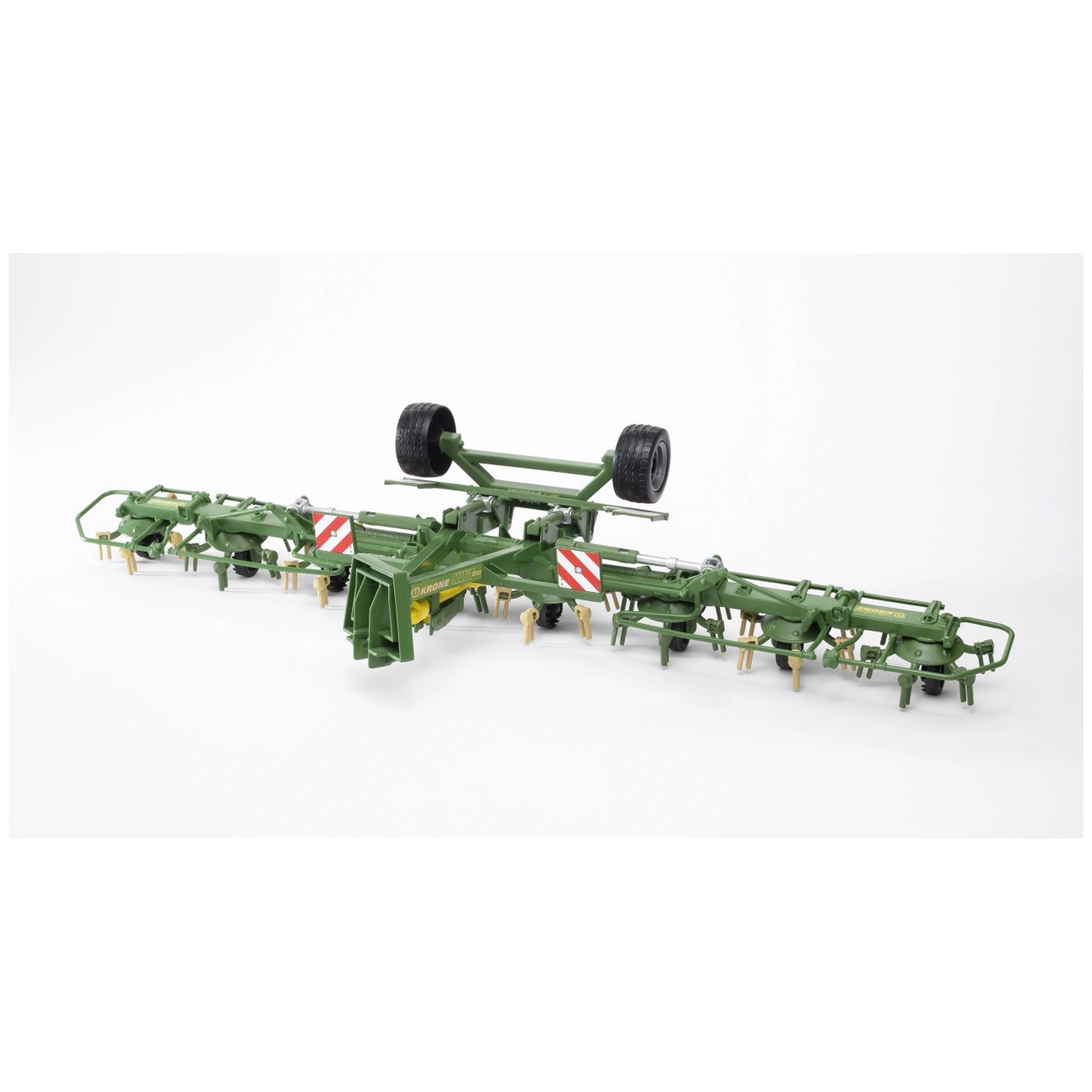 Green Bruder Krone Trailed Rotary Tedder model with detailed features, including wheels and red-striped panels, on white background.