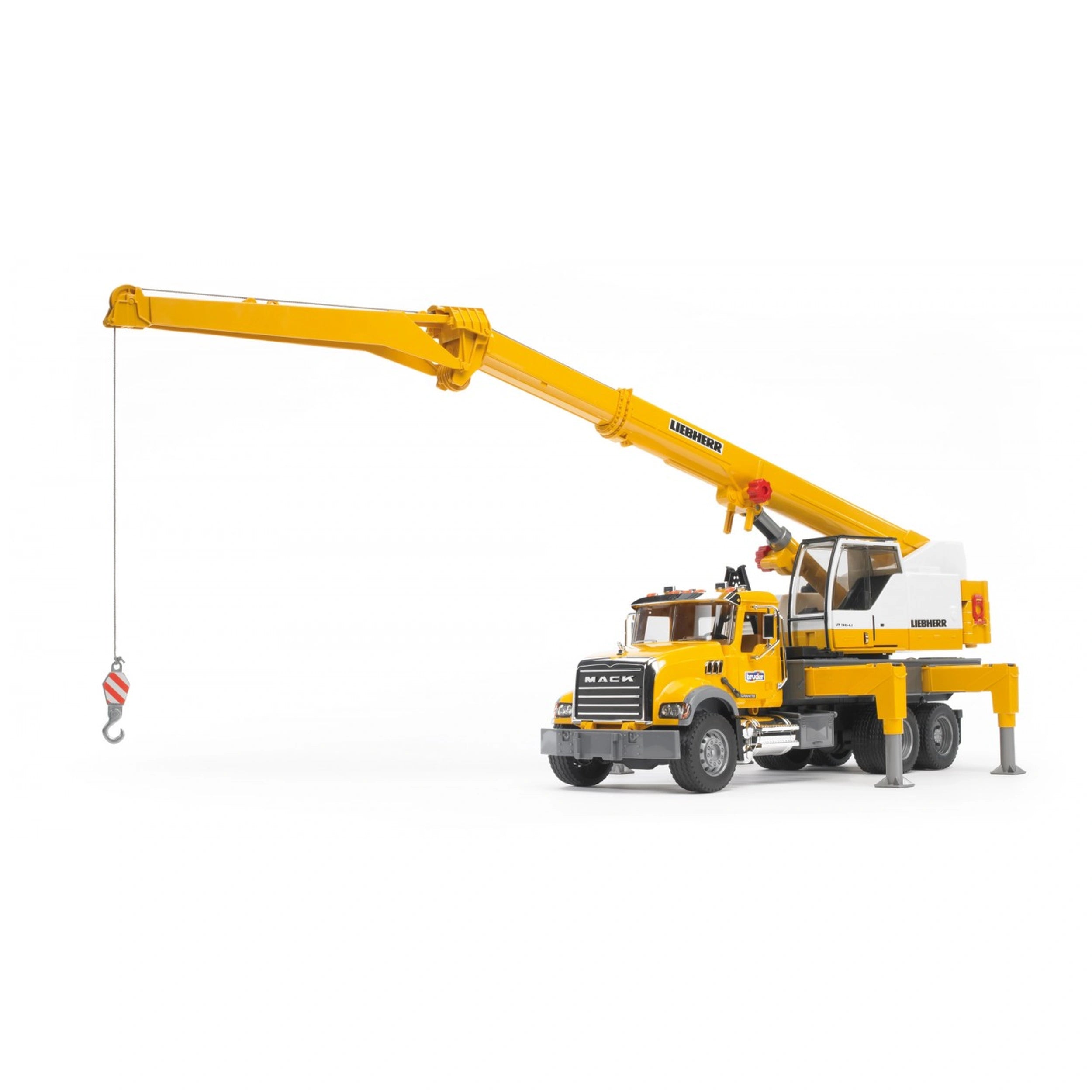 Yellow Bruder MACK Granite Liebherr crane truck toy with extendable boom and stabilizing support legs on white background.