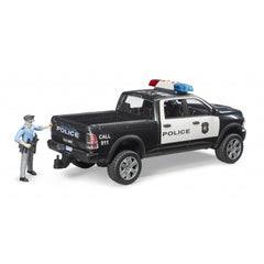 Black and white police pick-up truck toy with a police officer figure, featuring a light and siren module.