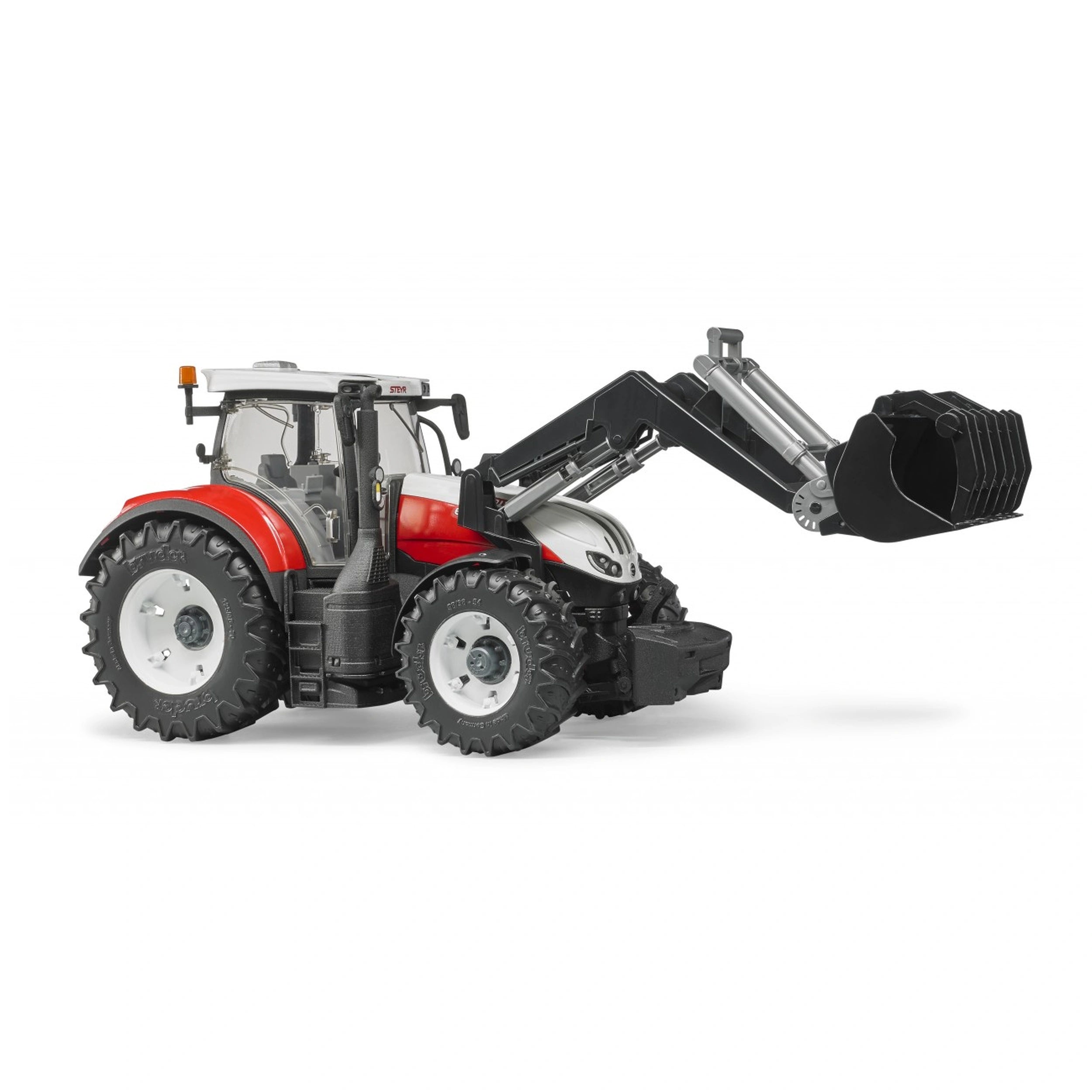 Red and white Bruder Steyr 6300 Terrus CVT toy tractor with front loader extended, detailed wheels, and glazed cabin.