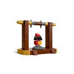 Colorful LEGO Fawkes construction set featuring a red and yellow phoenix figure on a brown perch with gold accents.