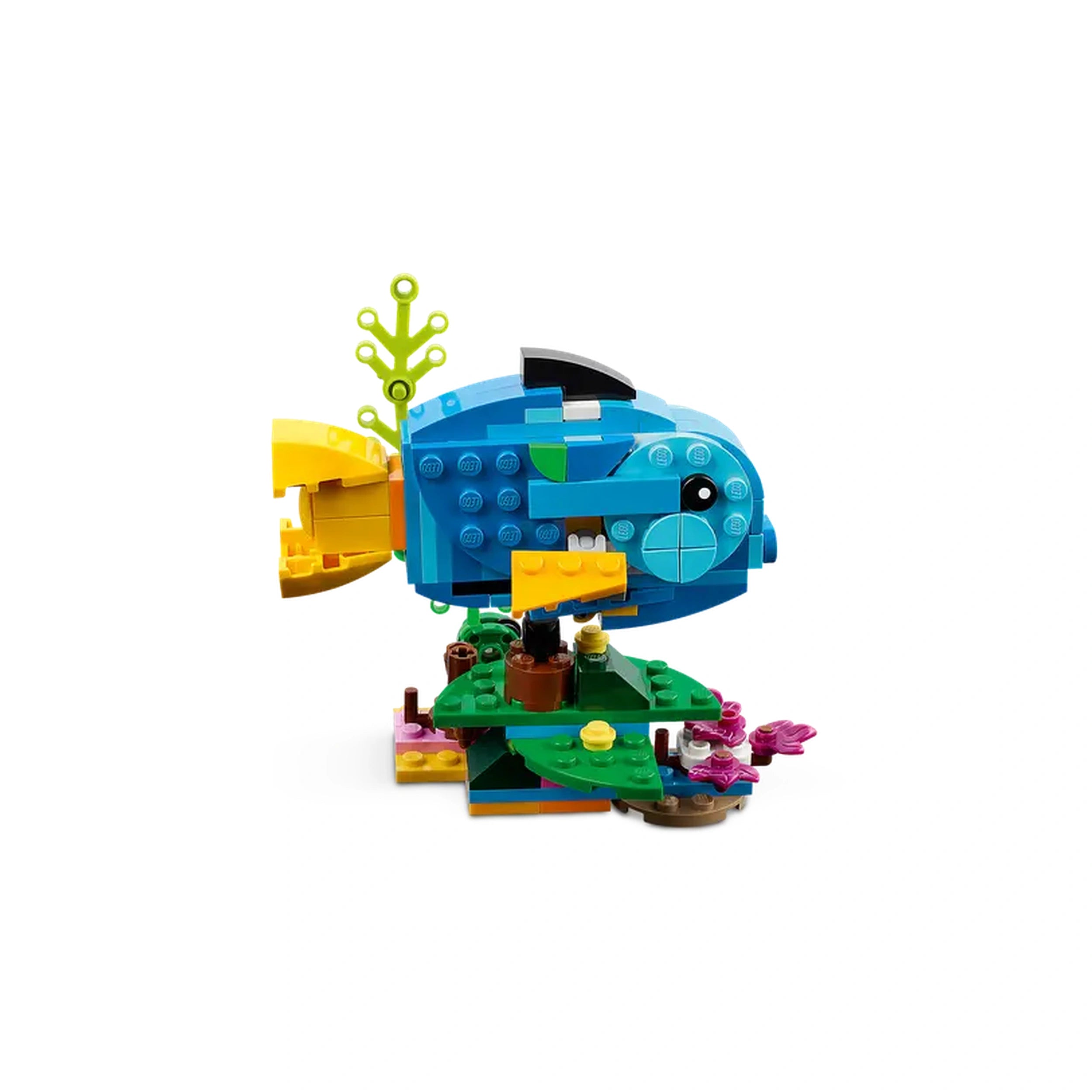 Colorful LEGO® construction of a blue fish with a yellow tail, surrounded by green leaves and pink flowers, showcasing creativity in play.