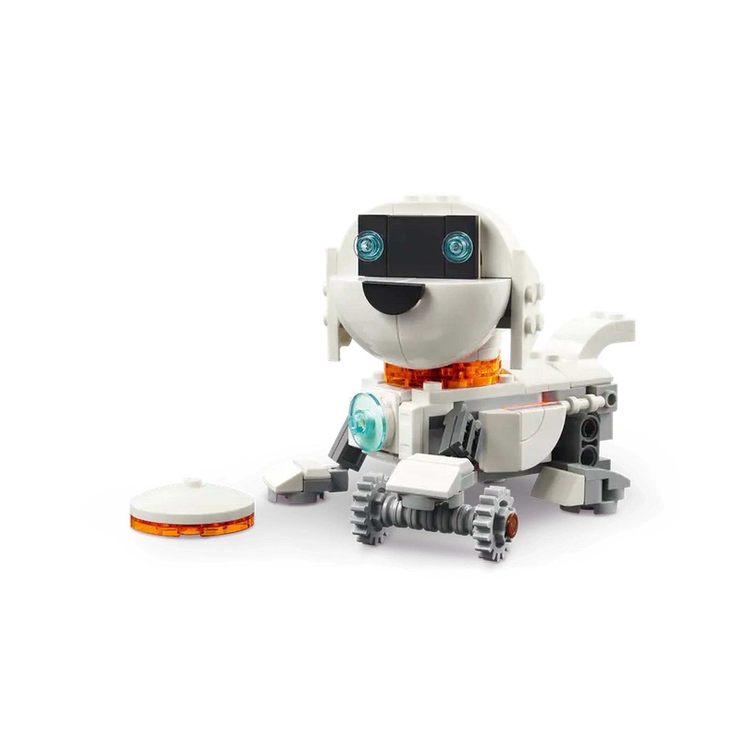 White robotic dog figure with a smiling face, blue eyes, and an orange collar, sitting next to a flying disc.