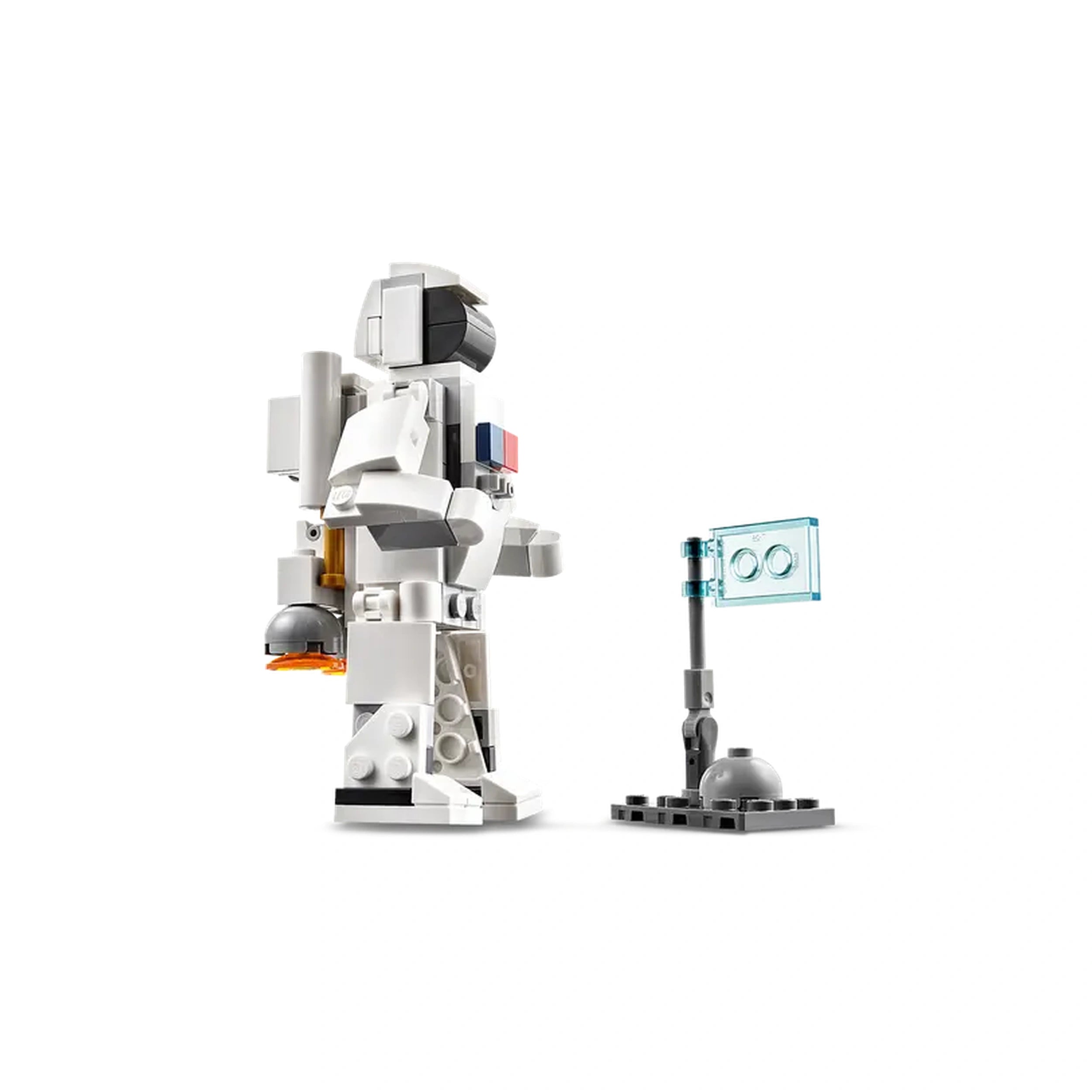 A posable LEGO astronaut figure in white and gray, equipped with a jetpack, stands next to a small flag on a base, ready for space exploration.