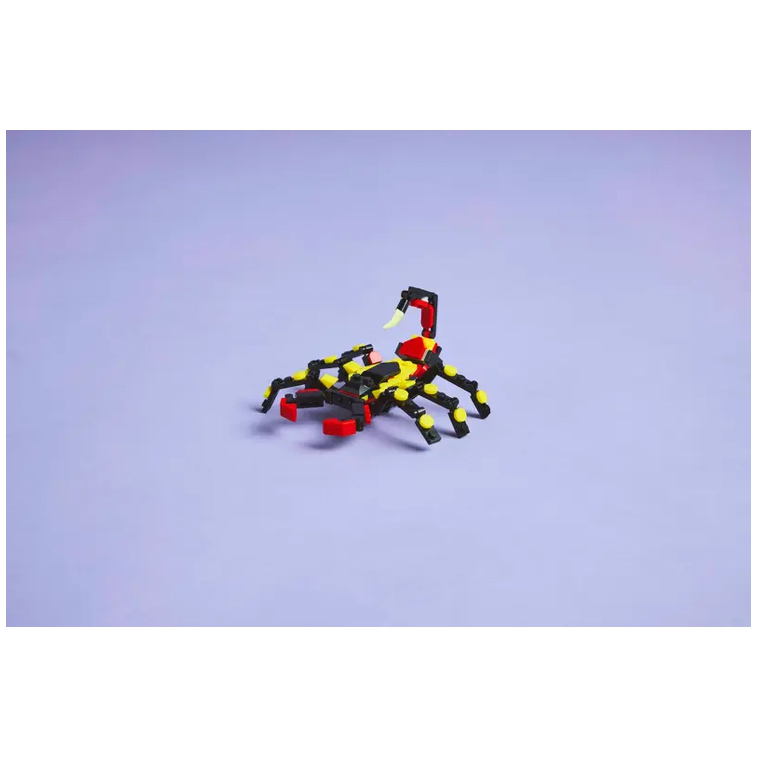 Posable LEGO spider figure with articulated legs, bright yellow and black colors, and red accents, set on a light purple background.
