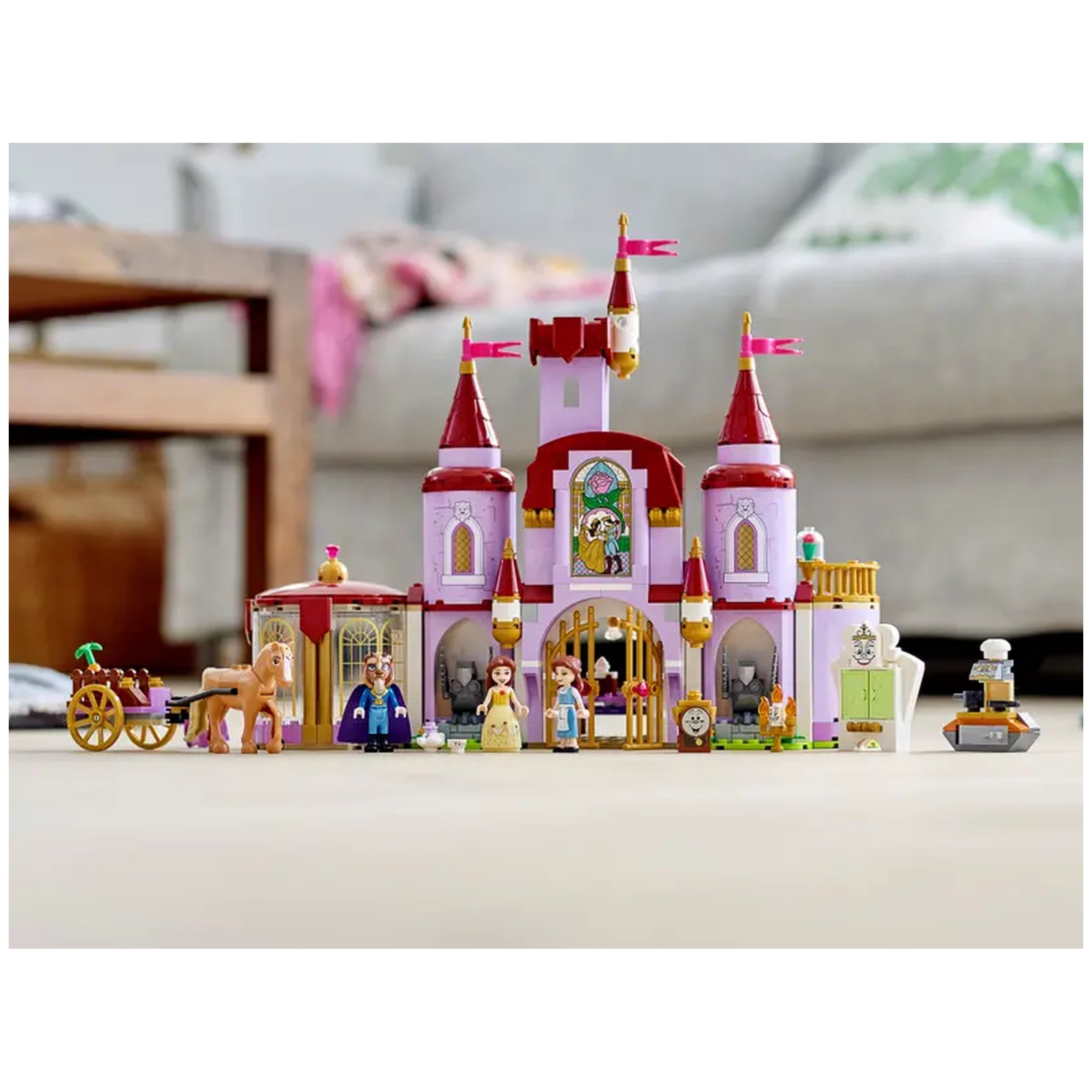 Enchanting LEGO® Disney Belle and the Beast's Castle set features a pink castle with red towers, colorful characters, and a horse, inviting imaginative play.