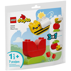 Lego Duplo My First Flower & Bee set packaging featuring a red flower and a cheerful yellow bee with an inviting blue sky background.