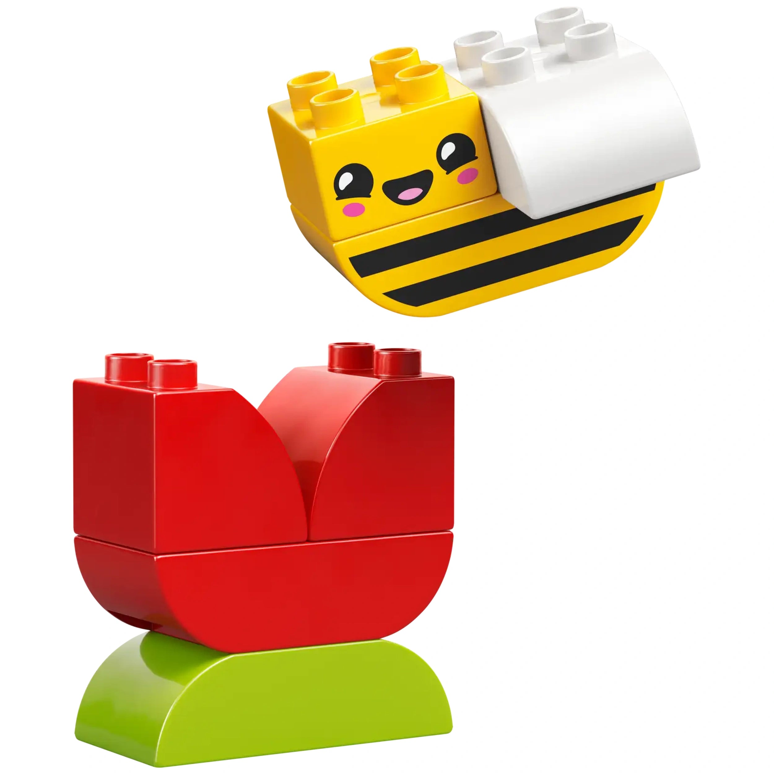A cheerful yellow bee block with a smiley face hovers above a bright red flower block, resting on a green base.