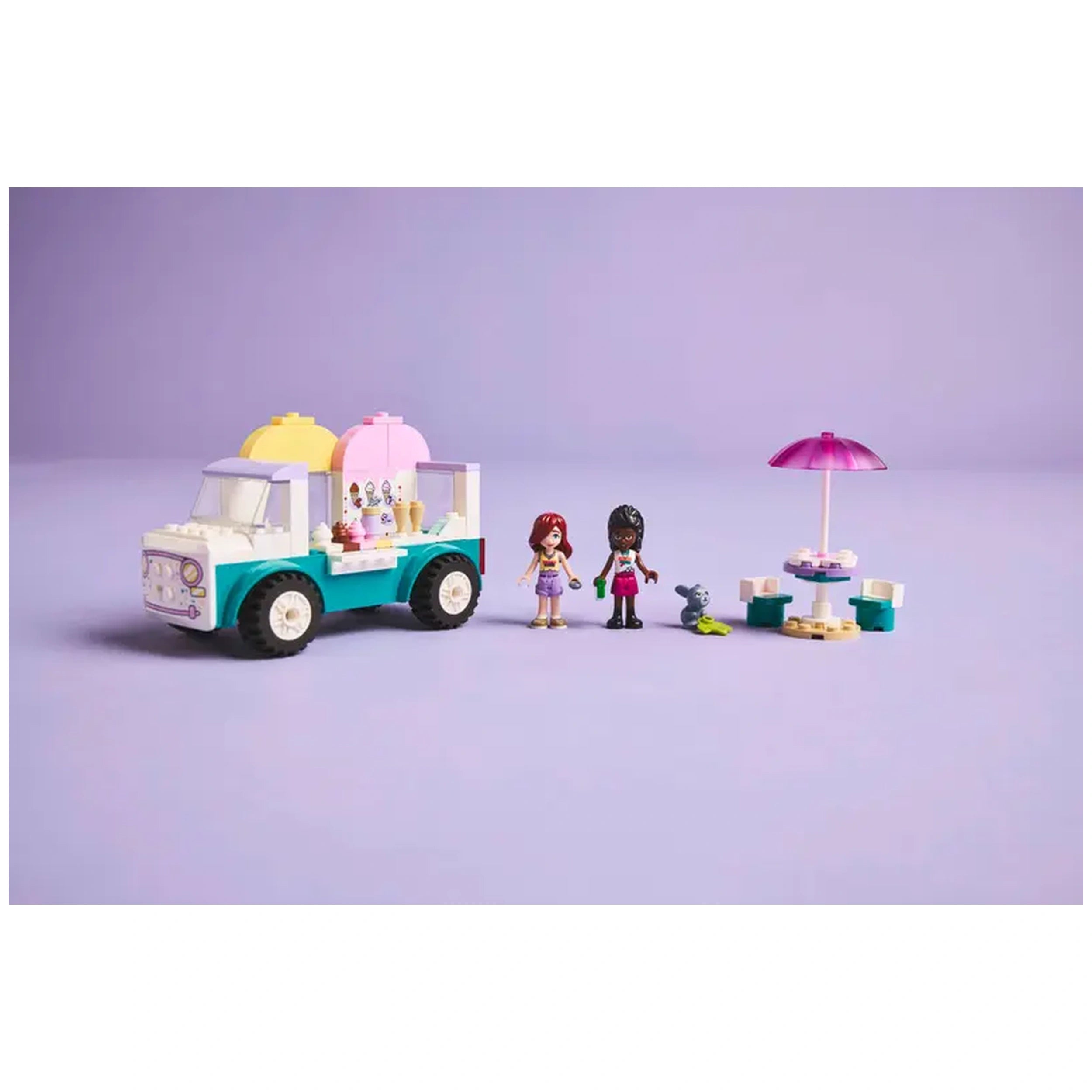 Lego Friends Heartlake City Ice Cream Truck set featuring two minidolls, a bunny figure, and a colorful ice cream truck with an umbrella table.