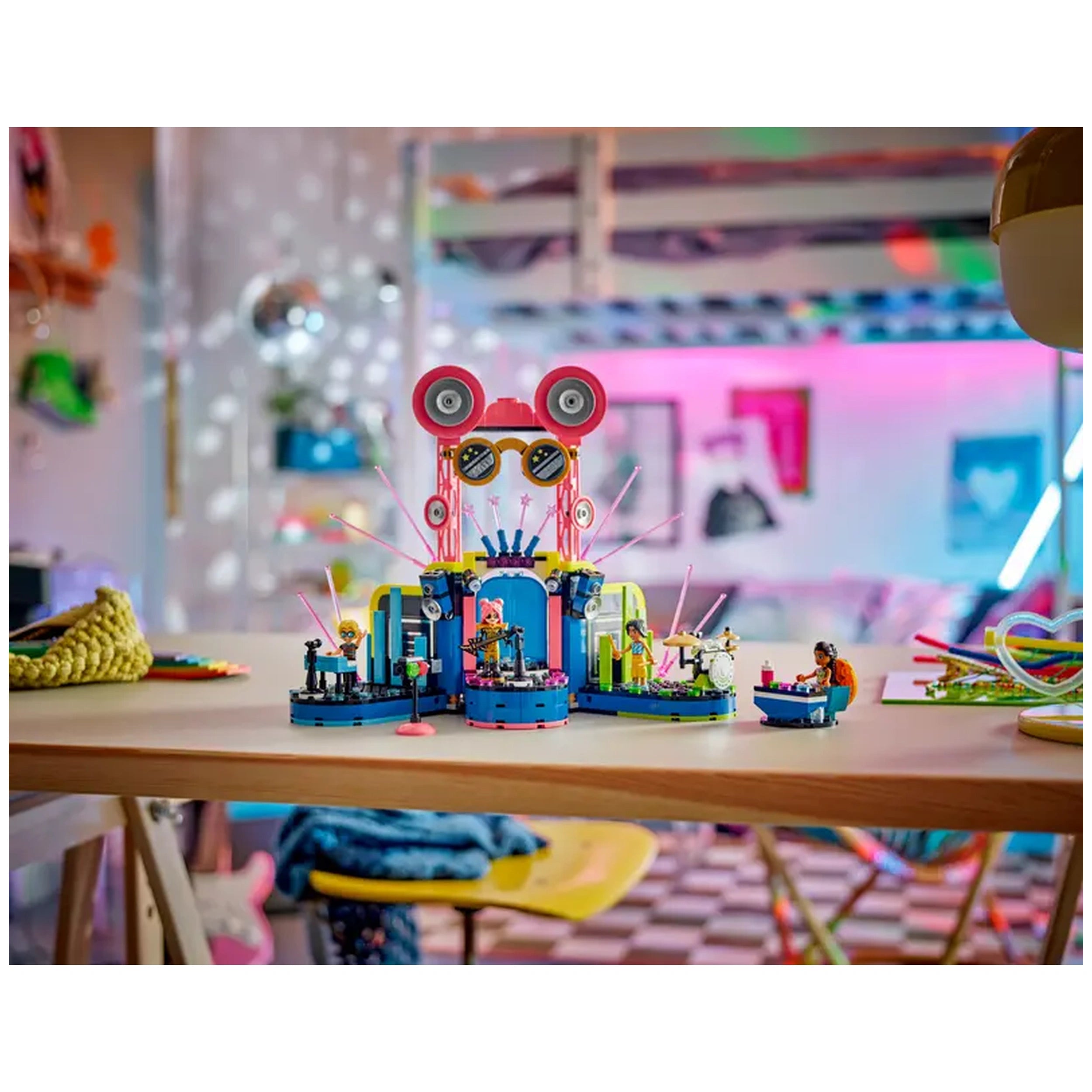 Colorful LEGO Friends Heartlake City Music Talent Show set featuring a vibrant music stage with mini-dolls performing, surrounded by playful decor.