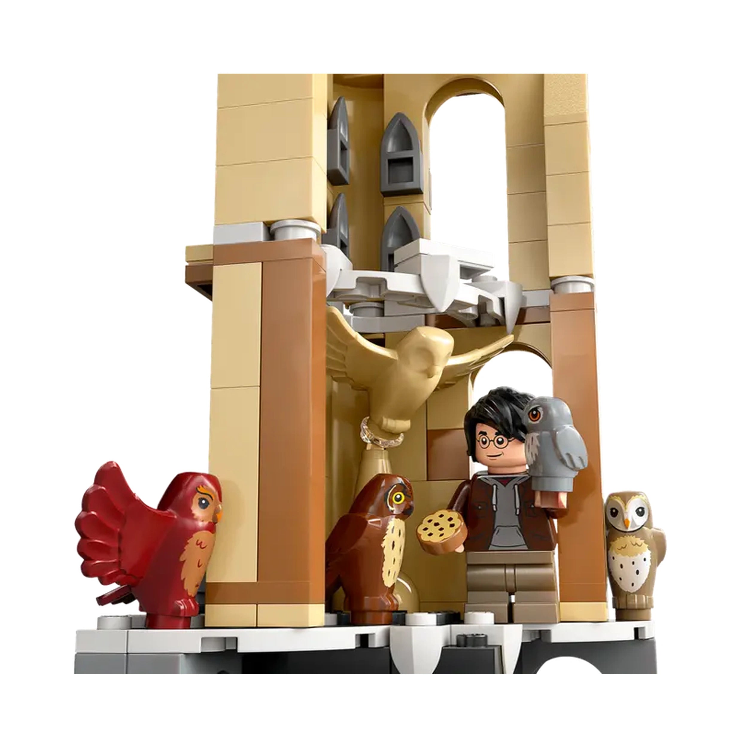 LEGO Harry Potter Owlery set featuring a young wizard holding an owl and a cookie, surrounded by intricately designed owls and tower details.