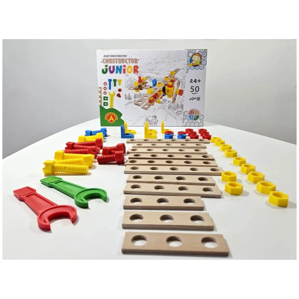 Constructor Junior Wooden Airplane Set with colorful screws, connectors, and 50 wooden pieces arranged on a table.