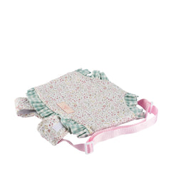 Floral baby carrier for 30-46 cm dolls with green ruffled edges and pink straps from the Así Dreams Cloe Collection.