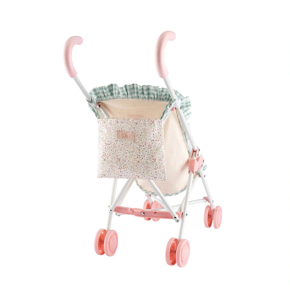White metal doll stroller with pink wheels and handles, floral-patterned bag, and green checkered fabric ruffle.