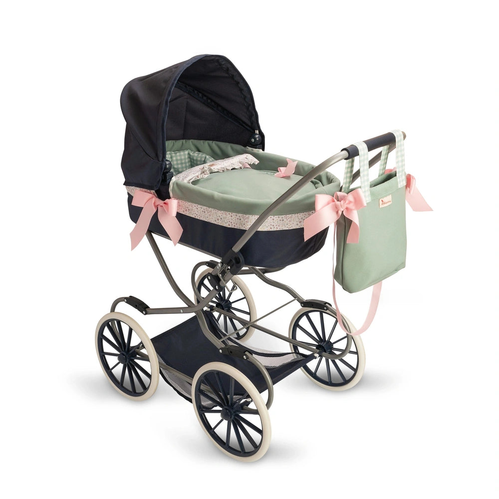 Elegant doll stroller with green carrycot, pink bows, and removable hood on black and white wheels. Includes matching bag.