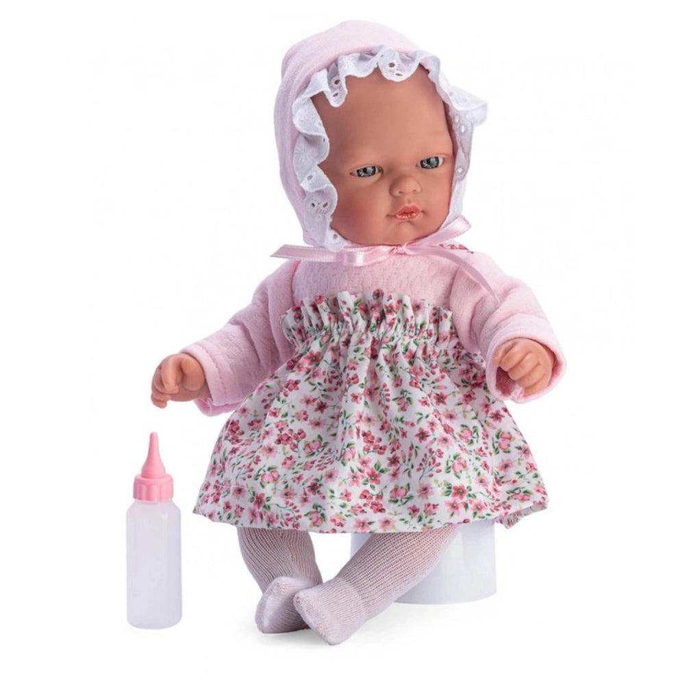 ASI Dolls 30 cm Lalka Oli in pink floral dress, bonnet, and bottle.