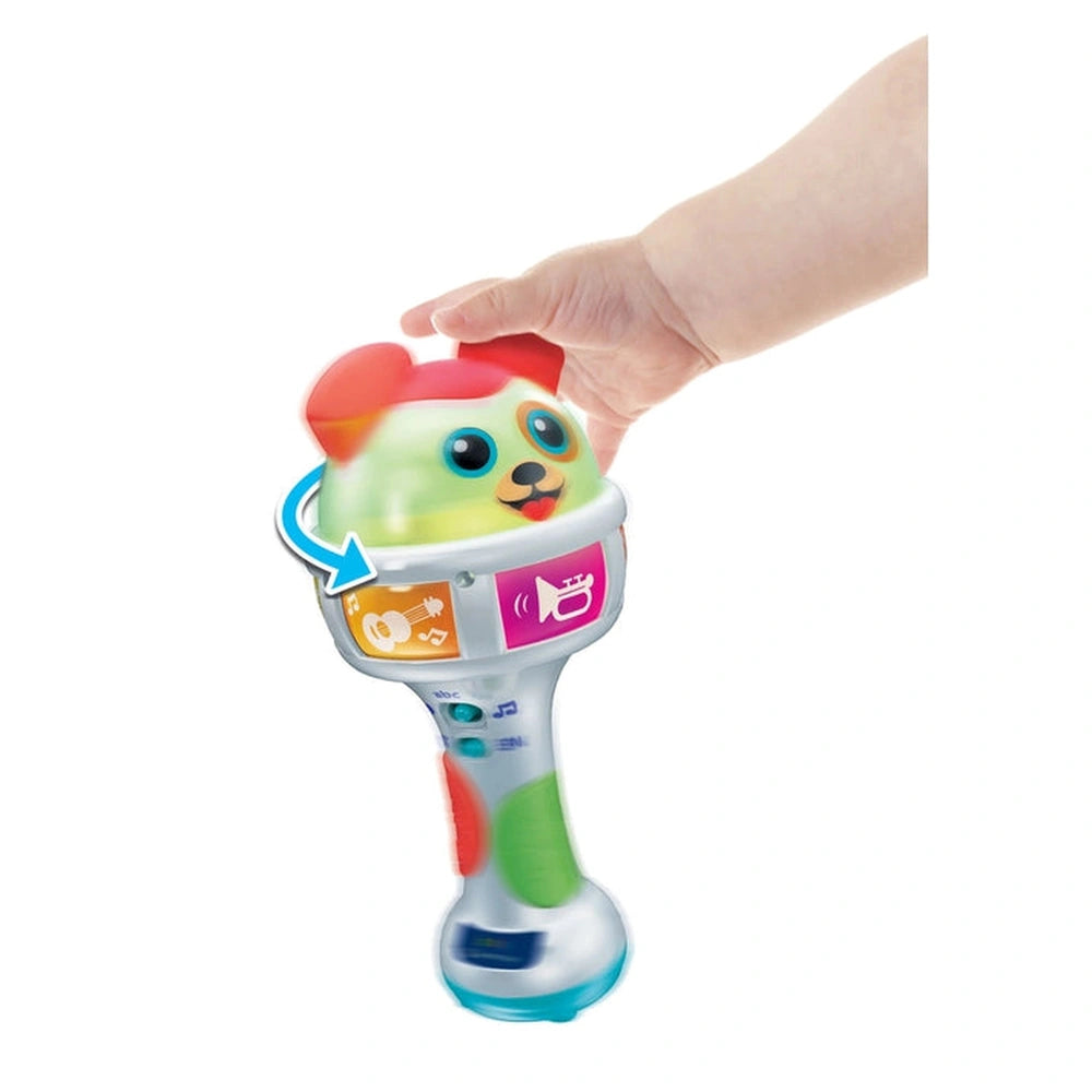 Baby Clementoni maracas toy in green with a red hat, featuring colorful buttons and a blue arrow, made of glossy plastic.