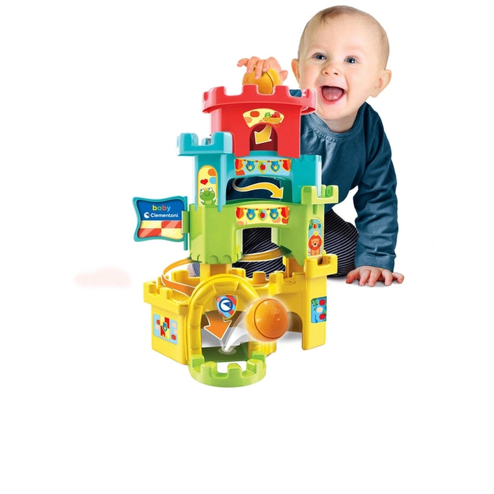 Baby Clementoni Ball Drop Castle features a yellow plastic structure with a red top, green bottom, and includes a toy car, ba