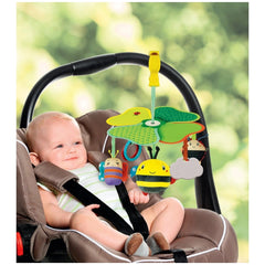 Baby Clementoni Easy-Peasy Travel Mobile with colorful hanging toys, featuring a baby in a fabric car seat with a brown cushi