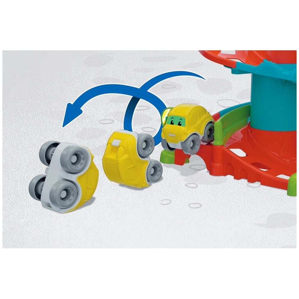 Baby Clementoni Fun Garage features a bright yellow toy car with black wheels, green and red bumpers, and a blue roof on a sm